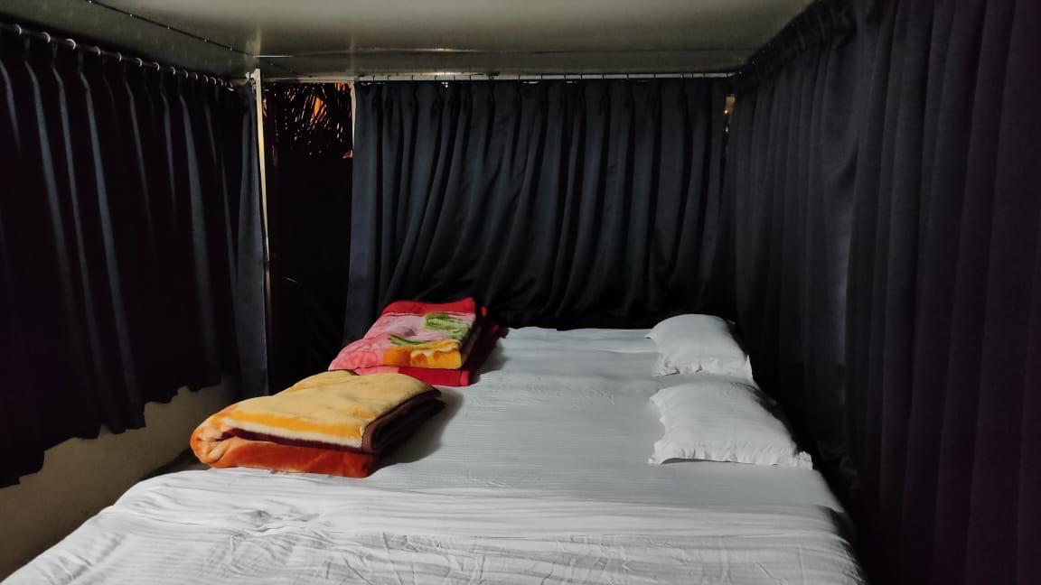 Comfortable cottage beds neatly arranged with warm bedding for guests