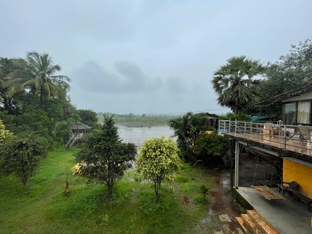 Panoramic balcony view of Wada's lush green countryside landscape on an overcast day